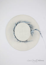 White ladies boater, top view with pale blue feather. Handmade millinery made in London.