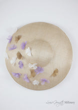 Wide brimmed disc hat with lilac and white flowers. Top view. Handmade in London.