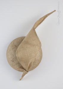 Gold straw button hat with twisted tie, top view.