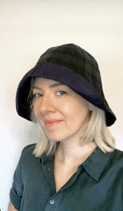 Lady wearing oilskin tartan hat made from digital download pattern