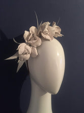 Leather and feather rose flower crown. 3/4 view.