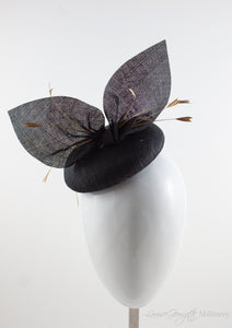 Black straw hat suitable for weddings, special occasions and race days. A popular straw style, our signature fun and timeless hat suits most face shapes and can be made in bespoke colours upon request.
