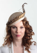 Allegra gold feathered straw Beret on model. Millinery handmade in London. Front view.