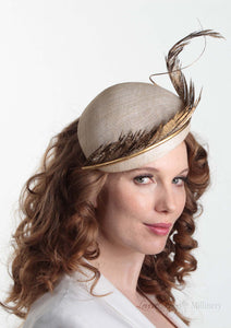 Allegra gold feathered straw Beret on model. Millinery handmade in London. Side view.