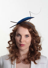 Navy two quill headband or fascinator on Model. Front view. Handmade millinery made in London.