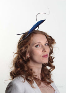 Navy two quill headband or fascinator on Model. Side view. Handmade millinery made in London.