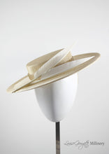 Natural coloured straw boater hat with two cream feathers. Handmade London Millinery. Front view.