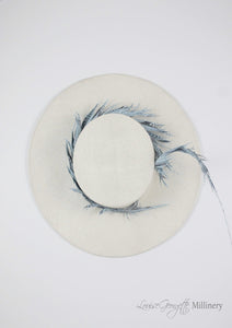 White ladies boater, top view with pale blue feather. Handmade millinery made in London.