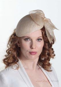 Cassandra natural straw Beret with side bow. Model front view. Handmade Millinery made in London.