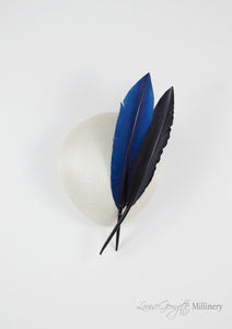 Ivory beret style ladies hat with two quills. Top view. Handmade millinery made in London.