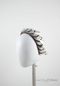 Ivory and Brown/Black stripped feather headband. Side view. Handmade millinery made in London.