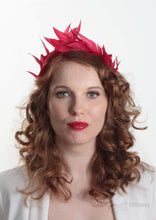 Hand sewn red feathers in tiara crown shape. Handmade in London and made to order. Model Front view.