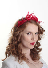Flame feather tiara crown. Millinery handmade in London. Model side view.