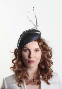 Navy two feather Beret. Millinery handmade in London. Model front view.