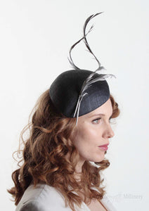 Navy two feather Beret. Millinery handmade in London. Model side view.