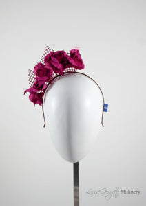 Leather roses on headband with reflective lattice detail. Millinery handmade in London. Front view. Pink