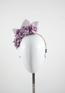 Leather roses on headband with reflective lattice detail. Millinery handmade in London. Front view. Pink side view