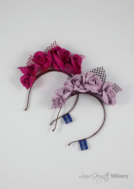 Leather roses on headband with reflective lattice detail. Millinery handmade in London. Flat top view. Pink and Lilac