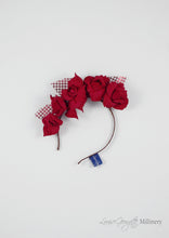 Patterned Leather roses on headband with reflective lattice detail. Millinery handmade in London. Flat view.
