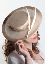 Harper natural and cream boater with two quills. Millinery handmade in London. Side close up view with model.