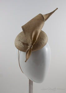 Gold straw button hat with twisted tie, side view.