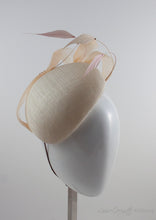 Handblocked beret style cocktail hat with pink and peach hand sculpted feathers and curled peach crinoline ribbon.3/4 View.
