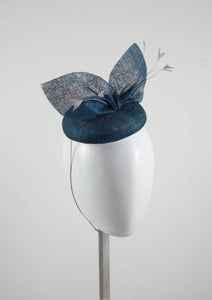 Blue pinokpok pillbox with bow and feather detail. Handmade Millinery made in London - Louise Georgette Millinery side view.