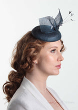 Blue pinokpok pillbox with bow and feather detail. Handmade Millinery made in London - Louise Georgette Millinery side view.