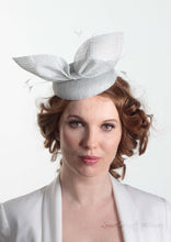 Hayley small disc Hat with bow detail in ice blue. Model front view. Hand