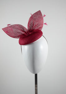 Red straw hat with red feathers. Suitable for weddings, special occasions and race days. A popular straw style, our signature fun and timeless hat suits most face shapes and can be made in bespoke colours upon request.