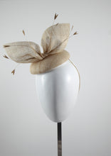 Cream straw hat with gold feathers. Suitable for weddings, special occasions and race days. A popular straw style, our signature fun and timeless hat suits most face shapes and can be made in bespoke colours upon request.
