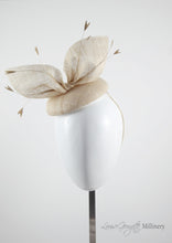 Natural coloured straw bow hat with feathers.Front view. Royal Ascot, Royal enclosure approved. Millinery handmade in London. Louise Georgette Millinery