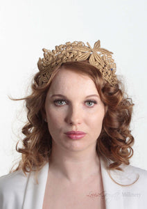 Lacey tiara style gold  crown on headband. Model front view. Millinery handmade in London.