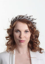 Ivory and Brown/Black stripped feather headband. Model front view. Handmade millinery made in London.
