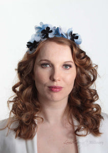 Sylvie metallic blue flower crown. Model front view. Millinery handmade in London. Louise Georgette Millinery.
