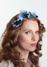 Sylvie metallic blue flower crown. Model side view. Millinery handmade in London. Louise Georgette Millinery.