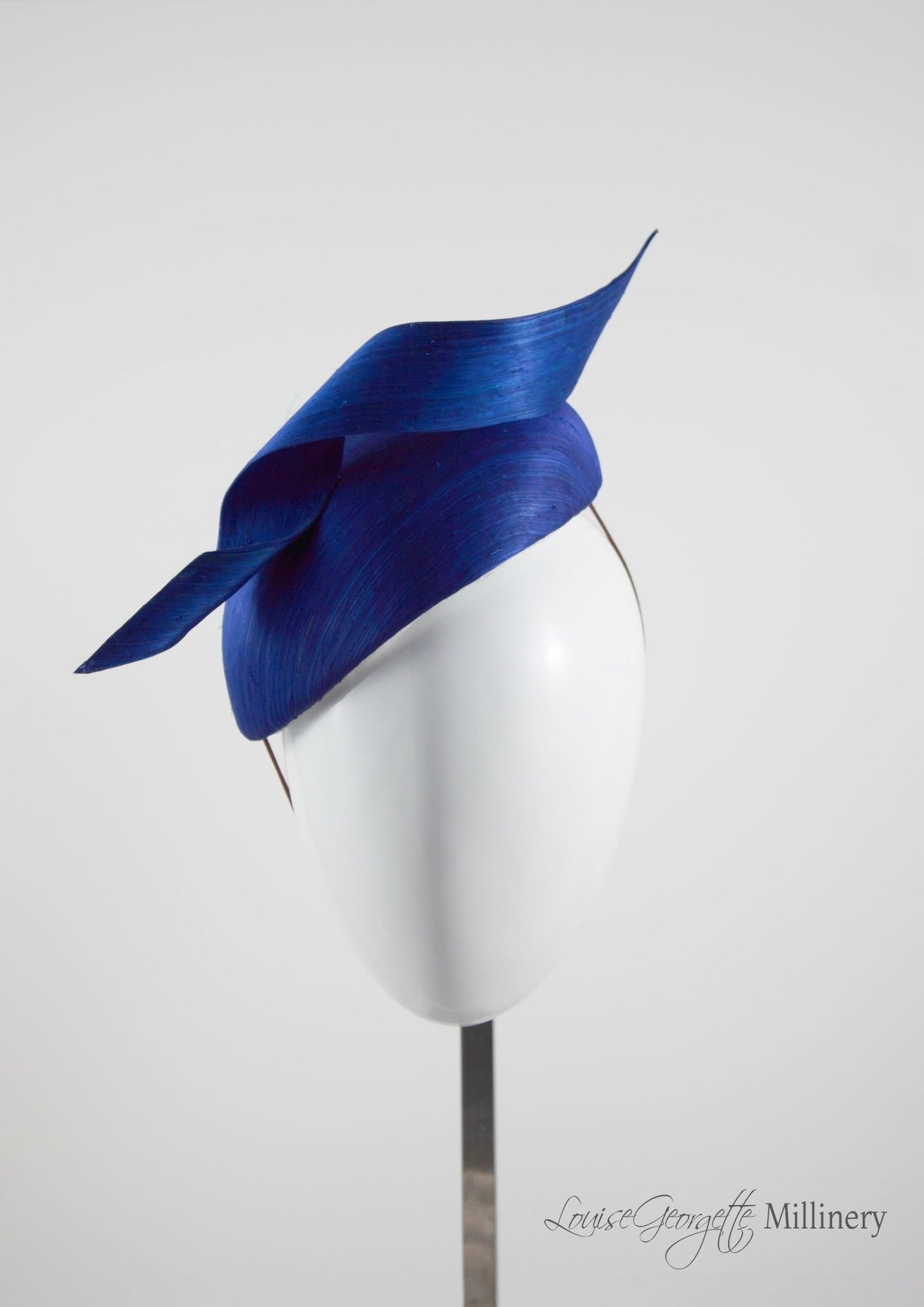 Side view, Silk Navy Beret hat with twist detail. Handmade in London, Millinery suitable for racing, weddings and other special occasions. 
